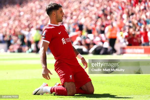 Dominik Szoboszlai of Liverpool celebrates after scoring the team's first goal during the Premier League match between Liverpool FC and Aston Villa...
