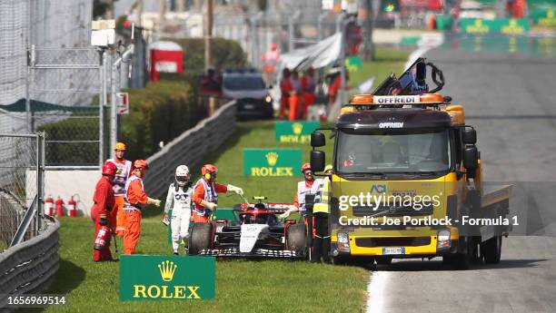 The car of Yuki Tsunoda of Japan and Scuderia AlphaTauri is recovered from the track after stopping on the formation lap during the F1 Grand Prix of...