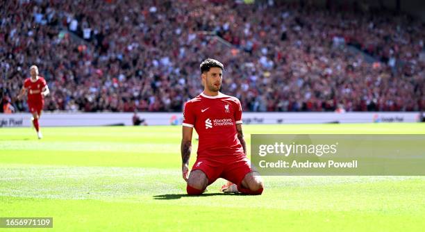 Dominik Szoboszlai of Liverpool celebrates after scoring the opening goal during the Premier League match between Liverpool FC and Aston Villa at...