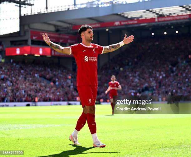 Dominik Szoboszlai of Liverpool celebrates after scoring the opening goal during the Premier League match between Liverpool FC and Aston Villa at...