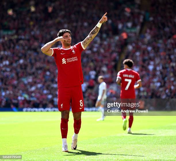 Dominik Szoboszlai of Liverpool celebrates after scoring the opening goal during the Premier League match between Liverpool FC and Aston Villa at...