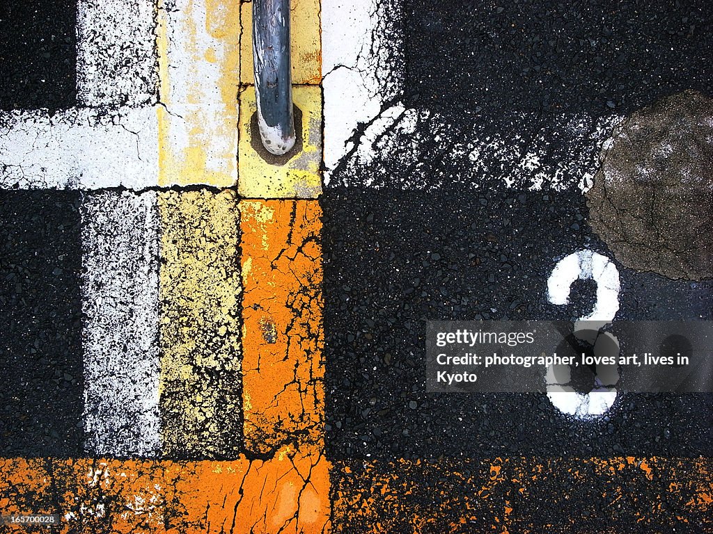 Number 3 and the line on asphalt