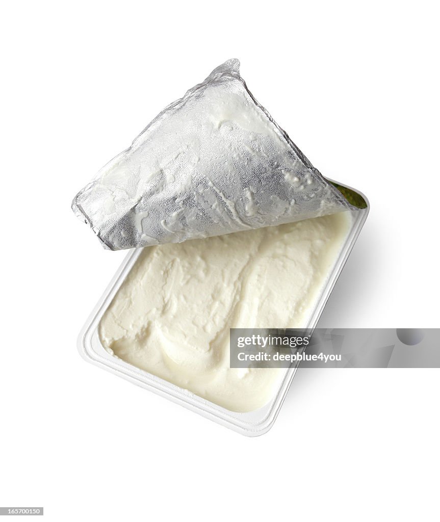 Just opened box cream cheese, isolated on white