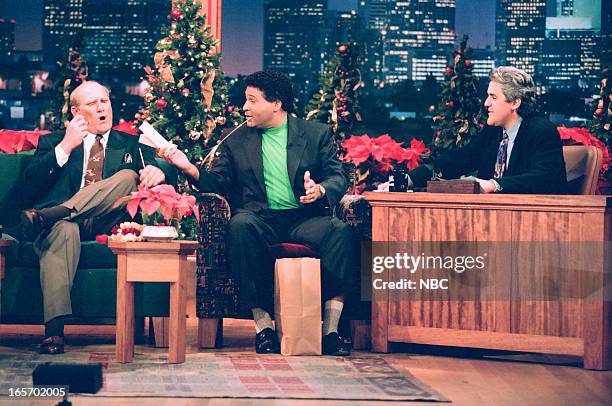 Episode -- Pictured: Former football player Terry Bradshaw, sportscaster Greg Gumbel during an interview with host Jay Leno on December 30, 1994 --