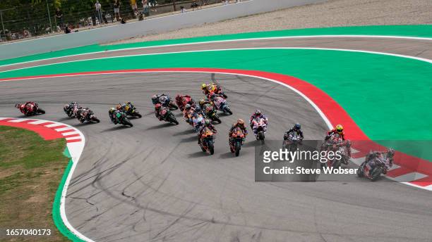 MotoGP riders after the restart at turn one during the race of the MotoGP Gran Premi Monster Energy de Catalunya at Circuit de Barcelona-Catalunya on...
