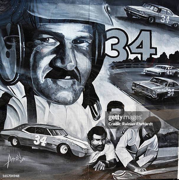 Mural depicting former NASCAR driver Wendell O. Scott Sr. Is shown painted on the side of his garage during a ceremony for the unveiling of a...