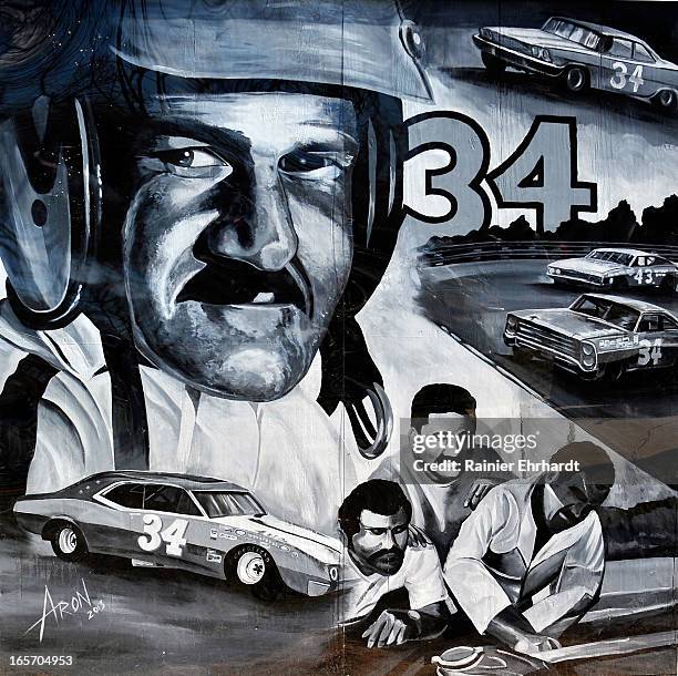 Mural depicting former NASCAR driver Wendell O. Scott Sr. Is shown painted on the side of his garage during a ceremony for the unveiling of a...