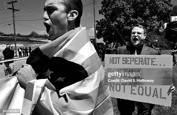 White Revolution chairman Billy Roper unknowingly holds a misspelled sign during an event he organized to protest the anniversary of the Brown vs....