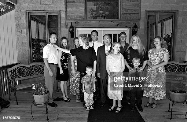 Ku Klux Klan National Director Thom Robb, center, stands with his family in front of his church on Sunday June 12, 2005 near Zinc, Arkansas. Robb's...