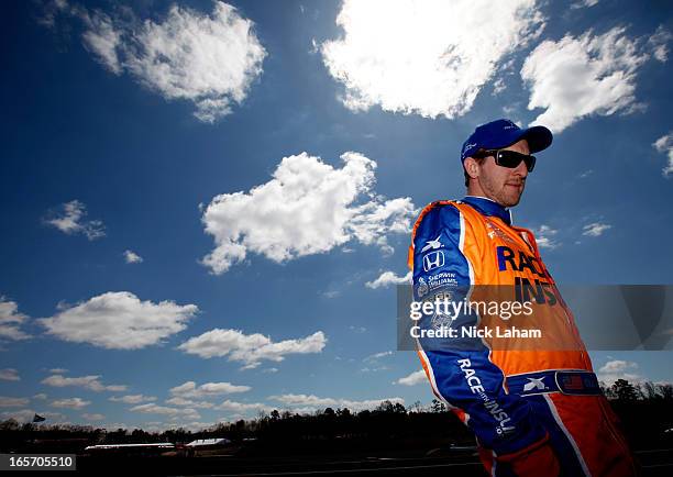Charlie Kimball, driver of the Novo Nordisk Chip Ganassi Racing Honda stands in pit road prior to practice for the Honda Indy Grand Prix of Alabama...