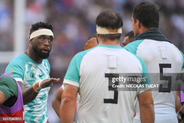 South Africa's flanker and captain Siya Kolisi gestures to his players at a water break during the France 2023 Rugby World Cup Pool B match between...