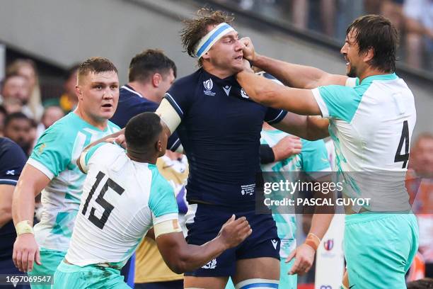 Scotland's flanker and captain Jamie Ritchie and South Africa's lock Eben Etzebeth engage in an argument during the France 2023 Rugby World Cup Pool...