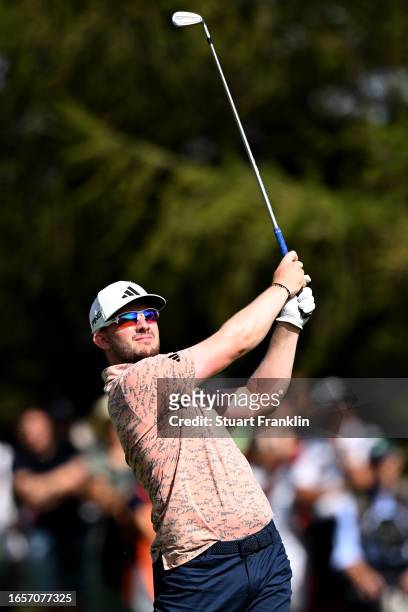 Connor Syme of Scotland plays his second shot on the 14th hole during Day Four of the Omega European Masters at Crans-sur-Sierre Golf Club on...