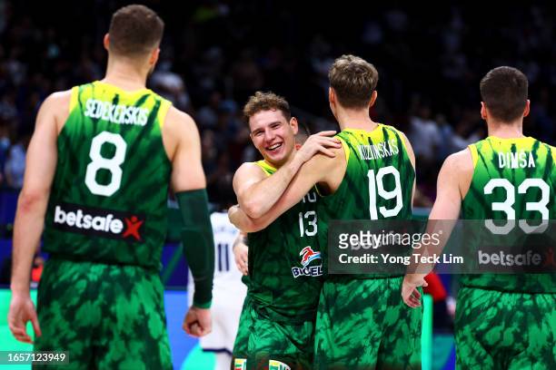 Tadas Sedekerskis, Rokas Jokubaitis, Mindaugas Kuzminskas and Tomas Dimsa of Lithuania celebrate after the FIBA Basketball World Cup 2nd Round Group...