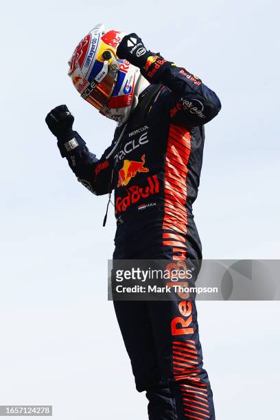 Race winner Max Verstappen of the Netherlands and Oracle Red Bull Racing celebrates his record tenth consecutive race win in parc ferme during the F1...