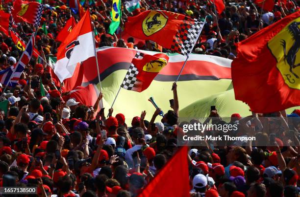 Ferrari fans wave flags at the podium celebrations during the F1 Grand Prix of Italy at Autodromo Nazionale Monza on September 03, 2023 in Monza,...