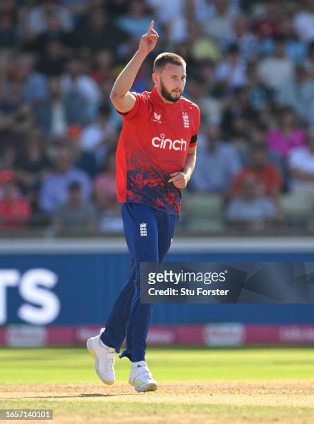 England bowler Gus Atkinson celebrates the wicket of Daryl Mitchell during the 3rd Vitality T20I between England and New Zealand at Edgbaston on...