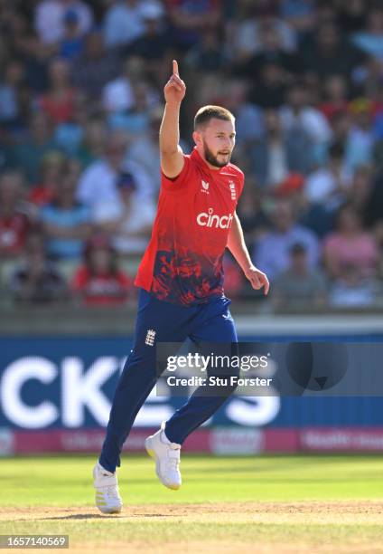 England bowler Gus Atkinson celebrates the wicket of Daryl Mitchell during the 3rd Vitality T20I between England and New Zealand at Edgbaston on...