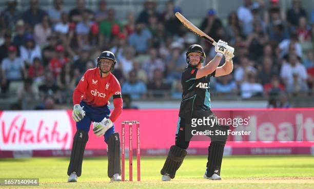 New Zealand batsman Glenn Phillips hits out watched by Jos Buttler during the 3rd Vitality T20I between England and New Zealand at Edgbaston on...