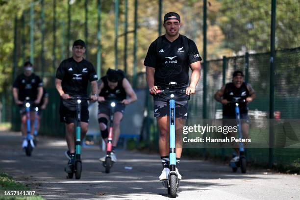Anton Lienert-Brown of the All Blacks arrives by scooter to a New Zealand All Blacks training session on September 03, 2023 in Lyon, France.