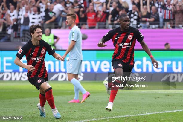 Niels Nkounkou of Eintracht Frankfurt celebrates after scoring the team's first goal during the Bundesliga match between Eintracht Frankfurt and 1....