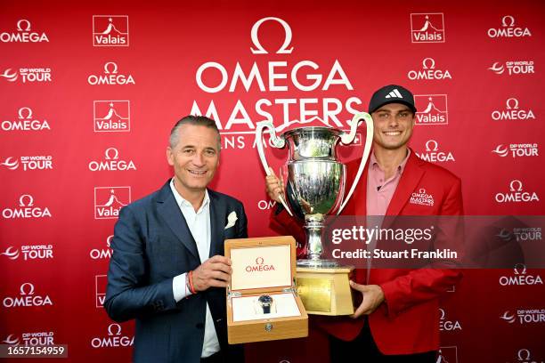 Ludvig Aberg of Sweden and Raynald Aeschlimann, OMEGA CEO and Presiden pose with the Omega European Masters trophy during Day Four of the Omega...