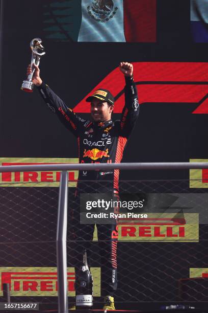 Second placed Sergio Perez of Mexico and Oracle Red Bull Racing celebrates on the podium during the F1 Grand Prix of Italy at Autodromo Nazionale...