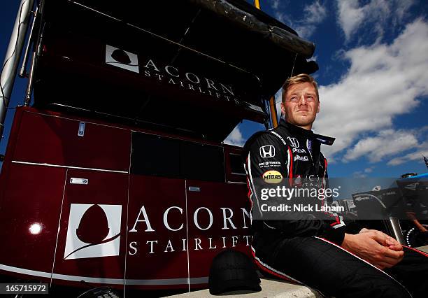 James Jakes of England, driver of the Rahal Letterman Lanigan Racing Honda sits on pit wall prior to practice for the Honda Indy Grand Prix of...