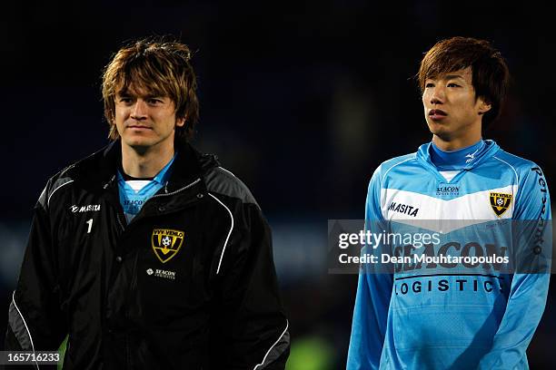 Robert Cullen and Yuki Otsu of Venlo walk off the ground after defeat in the Eredivisie match between Feyenoord and VVV Venlo at De Kuip on April 5,...