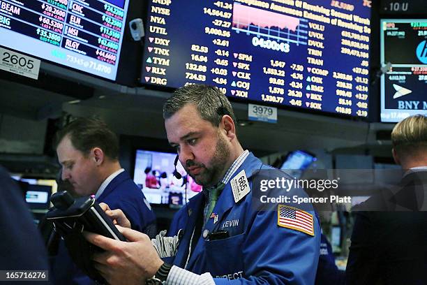 Traders work on the floor of the New York stock Exchange at the end of the trading day on April 5, 2013 in New York City. Following news of a...