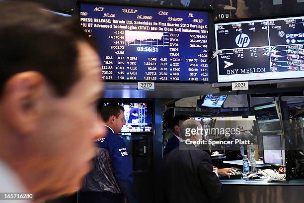 Traders work on the floor of the New York stock Exchange at the end of the trading day on April 5, 2013 in New York City. Following news of a...