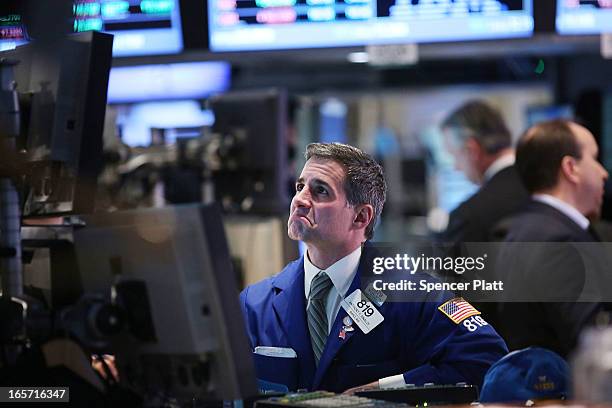 Trader works on the floor of the New York stock Exchange at the end of the trading day on April 5, 2013 in New York City. Following news of a...