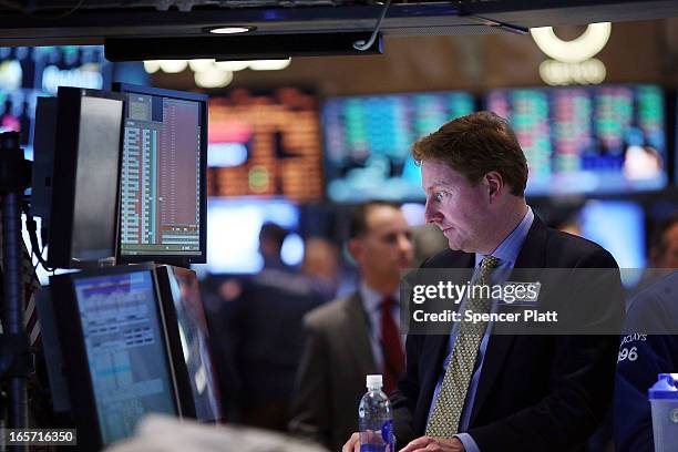 Traders work on the floor of the New York stock Exchange at the end of the trading day on April 5, 2013 in New York City. Following news of a...