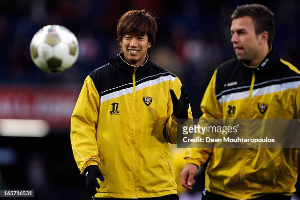 Yuki Otsu of Venlo has a laugh with team mates as he warms up prior to the Eredivisie match between Feyenoord and VVV Venlo at De Kuip on April 5,...