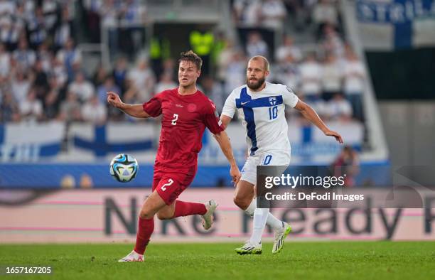 Teemu Pukki of Finland and Joachim Andersen of Denmark battle for the ball during the UEFA EURO 2024 European qualifier match between Finland and...