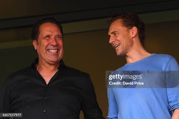 David Seaman, Former Arsenal Football Player and Actor, Tom Hiddleston look on prior to he Premier League match between Arsenal FC and Manchester...