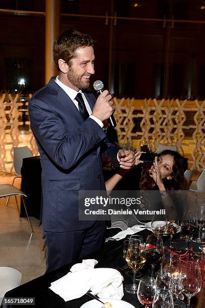 Gerard Butler and Madalina Ghenea attend a gala dinner by Antonello Colonna for the movie 'Olympus Has Fallen' on April 5, 2013 in Rome, Italy.