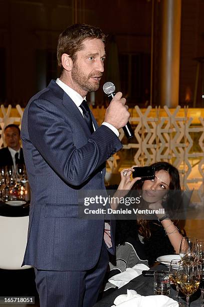 Gerard Butler and Madalina Ghenea attend a gala dinner by Antonello Colonna for the movie 'Olympus Has Fallen' on April 5, 2013 in Rome, Italy.