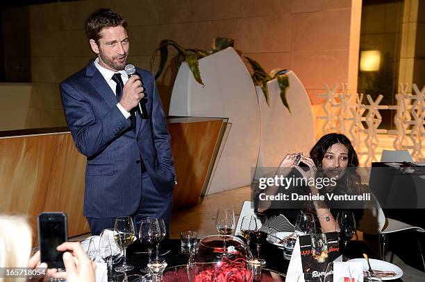 Gerard Butler and Madalina Ghenea attend a gala dinner by Antonello Colonna for the movie 'Olympus Has Fallen' on April 5, 2013 in Rome, Italy.