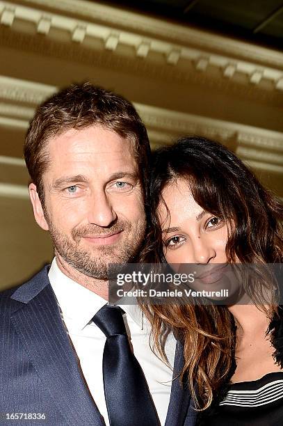 Gerard Butler and Madalina Ghenea attend a gala dinner by Antonello Colonna for the movie 'Olympus Has Fallen' on April 5, 2013 in Rome, Italy.