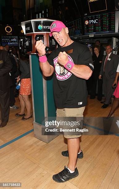 Actor John Cena rings the closing bell at the New York Stock Exchange on April 5, 2013 in New York City.