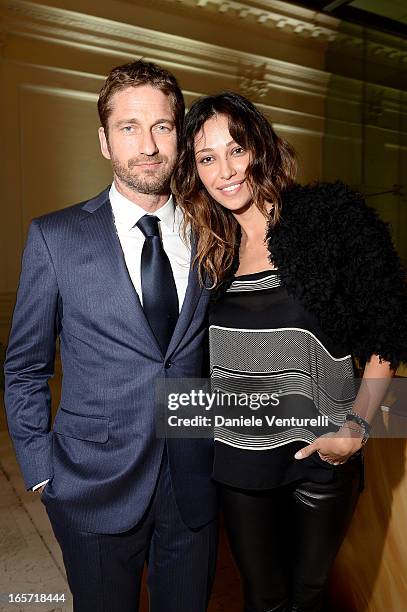 Gerard Butler and Madalina Ghenea attend a gala dinner by Antonello Colonna for the movie 'Olympus Has Fallen' on April 5, 2013 in Rome, Italy.