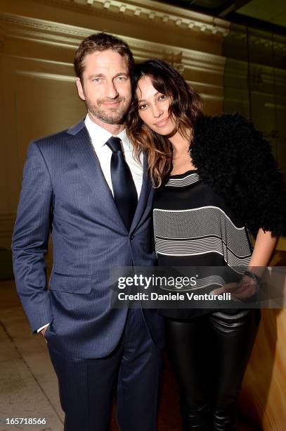 Gerard Butler and Madalina Ghenea attend a gala dinner by Antonello Colonna for the movie 'Olympus Has Fallen' on April 5, 2013 in Rome, Italy.