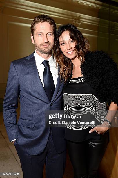 Gerard Butler and Madalina Ghenea attend a gala dinner by Antonello Colonna for the movie 'Olympus Has Fallen' on April 5, 2013 in Rome, Italy.