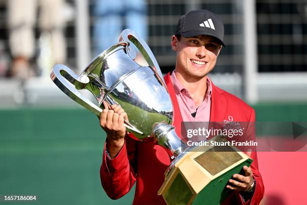 Ludvig Aberg of Sweden poses with the Omega European Masters trophy during Day Four of the Omega European Masters at Crans-sur-Sierre Golf Club on...