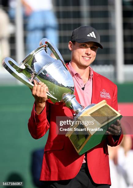 Ludvig Aberg of Sweden poses with the Omega European Masters trophy during Day Four of the Omega European Masters at Crans-sur-Sierre Golf Club on...