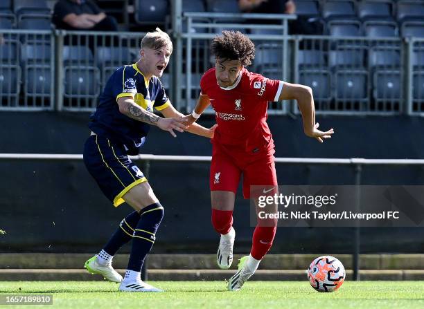 Kaide Gordon of Liverpool and Jack Hannah of Middlesbrough in action during the PL2 game at AXA Training Centre on September 03, 2023 in Kirkby,...