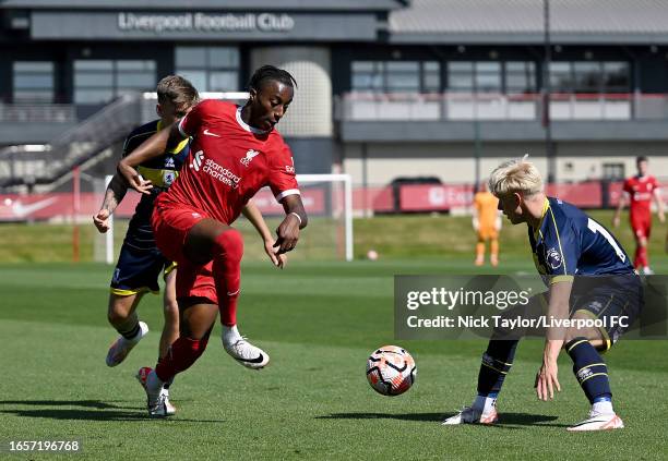 Isaac Mabaya of Liverpool and Max Howells of Middlesbrough in action during the PL2 game at AXA Training Centre on September 03, 2023 in Kirkby,...