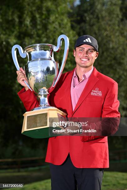 Ludvig Aberg of Sweden poses with the Omega European Masters trophy during Day Four of the Omega European Masters at Crans-sur-Sierre Golf Club on...