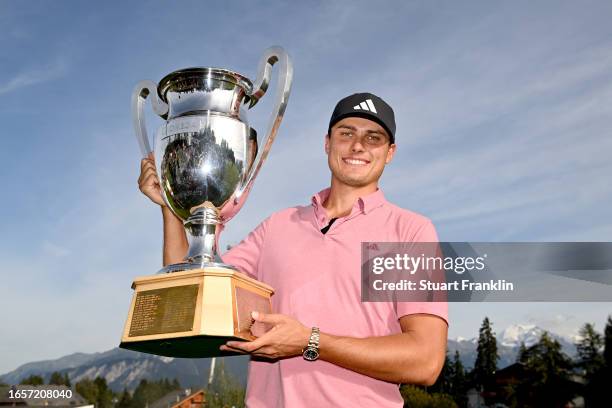 Ludvig Aberg of Sweden poses with the Omega European Masters trophy during Day Four of the Omega European Masters at Crans-sur-Sierre Golf Club on...